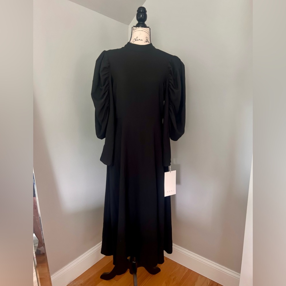Statement black midi dress with exquisite lines and styling by AGGI global, Sz S